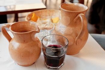 clay jugs with local red wine and water