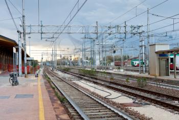 the last train on railroad station in evening, Ferrara, Italy