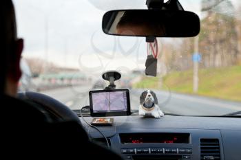 driving car with GPS Navigator on rural road in Russia