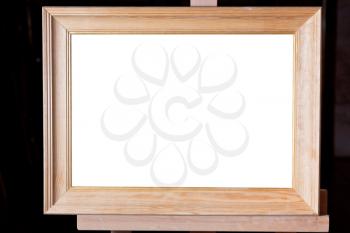 wide wooden picture frame with white cut out canvas