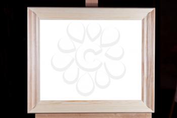 simple wide wooden picture frame with white cut out canvas