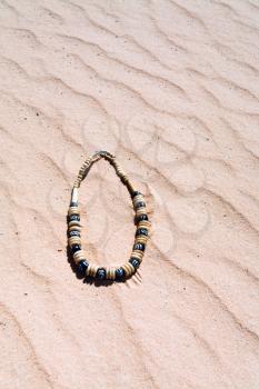 beads on red sand dune in Wadi Rum desert, Jordan