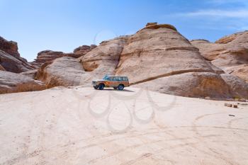 car in Wadi Rum desert mountain, Jordan