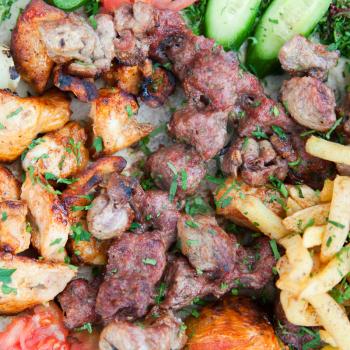 plate with mix arabic kebabs in Jordanian street restaurant