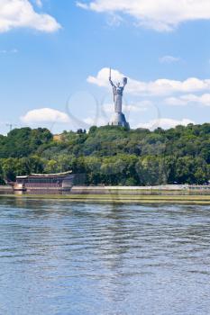riverside view on monument of Mother of the Fatherland from Dnieper River in Kiev, Ukraine