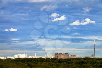 blue autumn sky with white clouds under city