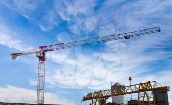 lifting crane under dark blue sky