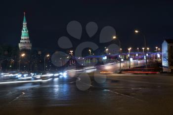 view on Great Stone Bridge and Vodovzvodnaya tower of Kremlin in Moscow at night