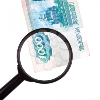magnifying loupe enlarge banknote isolated on white background