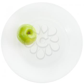 yellow green apple on white plate isolated on white background