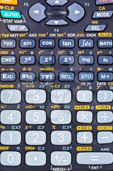 keyboard of scientific calculator with many mathematical functions close up