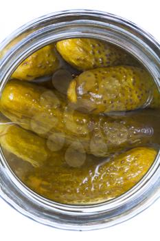 top view on salted cucumbers in glass jar