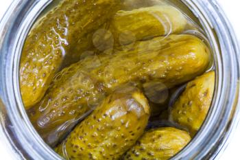 top view on pickled cucumbers in glass jar