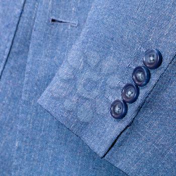 tailor background - fragment of blue silk men's suit close up