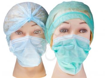 female manikin doctor heads wearing textile surgical cap and medical protective mask isolated on white background