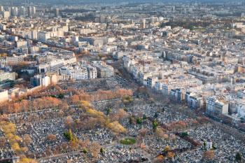 view on Montparnasse Cemeteryr and panorama of Paris in winter afternoon