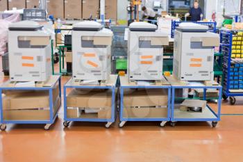 several assembled copiers on factory
