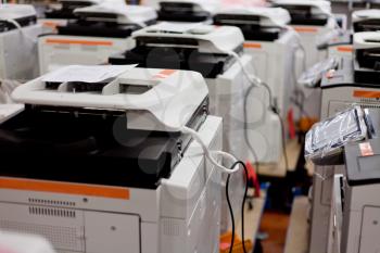 many assembled copiers on factory close up