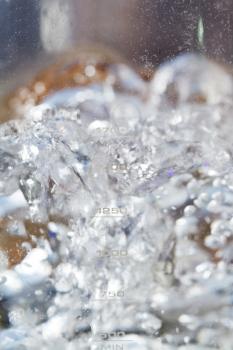 boiling water in glass electric kettle close up