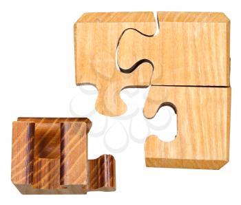 blocks of three dimensional wooden mechanical puzzle close up isolated on white background isolated on white background