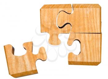pieces of three dimensional wooden mechanical puzzle close up isolated on white background