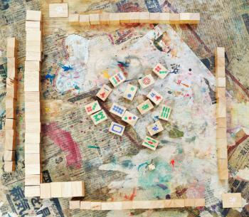 top view of playing field of mahjong board game on shabby table