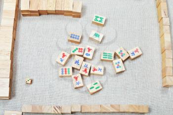 top view of playing field of mahjong board game on textile table