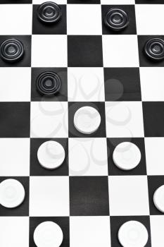 playing position on black and white checked checkers board