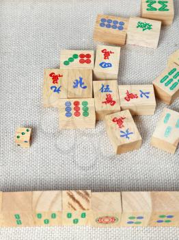 top view of wooden tiles of mahjong desk game on textile table