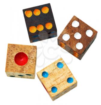 four wooden gambling dices close up isolated on white background