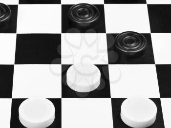 draughts game on black and white board close up