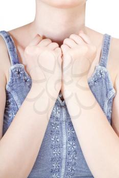 hands clenched into fists pressed to breast - gesture isolated on white background