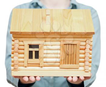 new log house on palms - hand gesture isolated on white background