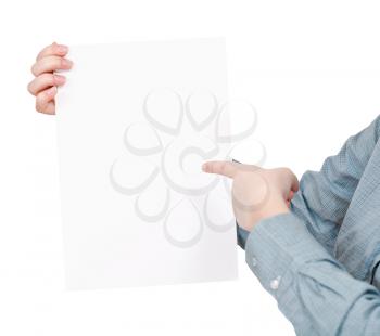 finger pointing on sheet of paper in female hand isolated on white background