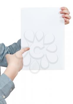 forefinger points on sheet of paper in female hand isolated on white background