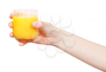 hand holds glass with fresh orange juice isolated on white background
