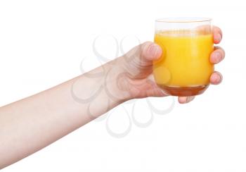 hand holds glass with orange juice isolated on white background