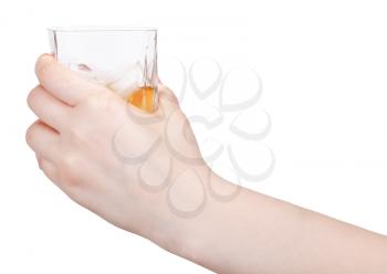 glass of whiskey in hand isolated on white background