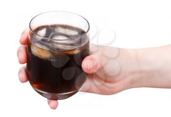 hand holding cola with ice in glass isolated on white background
