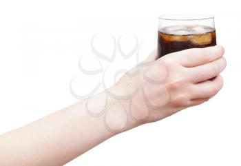 hand holding soft drink with ice in glass isolated on white background