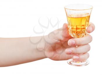 hand holds wineglass of sweet wine isolated on white background
