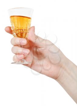 hand holds wineglass of aperitif wine isolated on white background