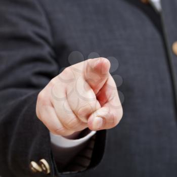 front view of businessman points by forefinger close up - hand gesture