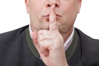 front view of male finger near lips - silence hand gesture isolated on white background