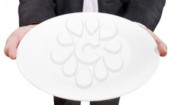 above view of businessman holds empty white plate close up isolated on white background