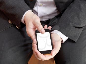 above view of smartphone with cut out screen in businessman hand