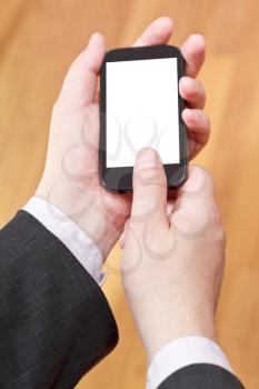 communicator with cut out screen in businessman hands close up
