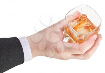 above view of whiskey with ice glass in businessman hand isolated on white background