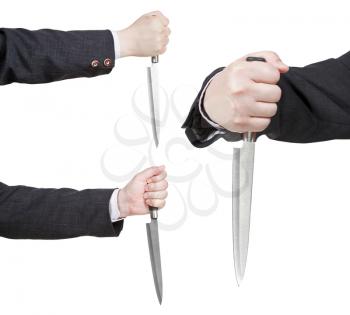 set of knife in businessman hand isolated on white background