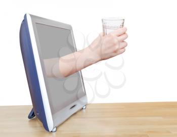 hand holding clear water in glass leans out TV screen isolated on white background
